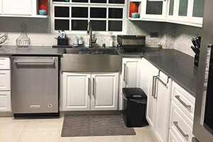 Danville Cabinet Fronts finished in White with Frosted Glass. Trendy Apron/Farmhouse Sink fitted.